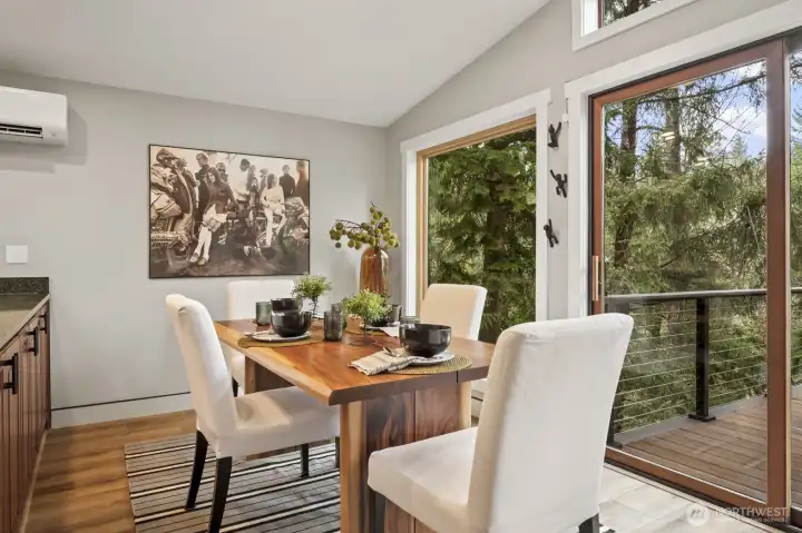 Enjoy meals in the bright dining space just off the kitchen with peaceful surrounding views.