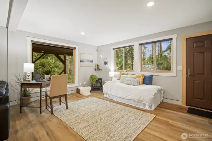 Free-standing propane fireplace for added warmth and ambiance.