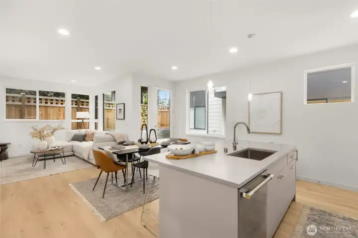 Relax in style with wide-plank flooring and designer lighting that adds a touch of modern warmth.