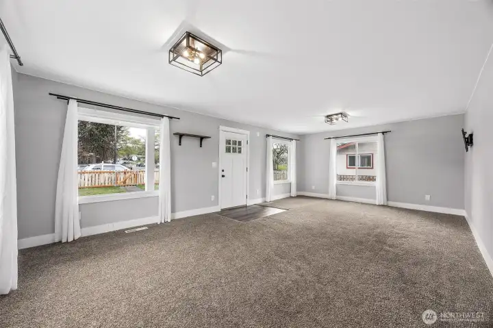 Living room looks out towards EHS and Mashell Ave N.