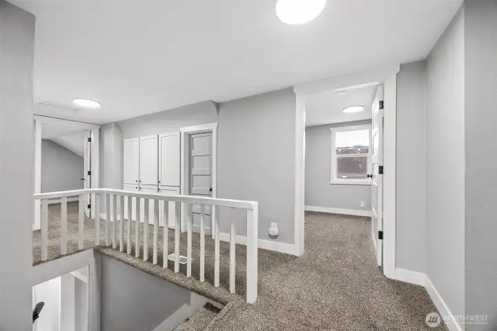 Built in storage cabinets and closet door to walk in storage