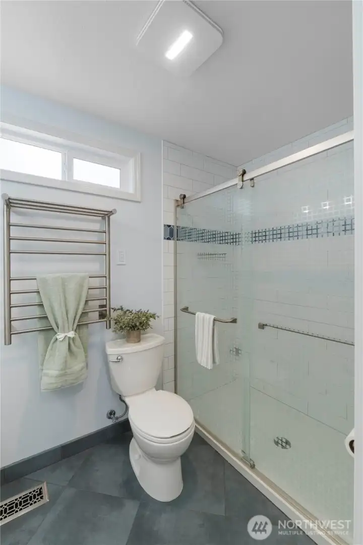 Your shower has custom subway tile and design.