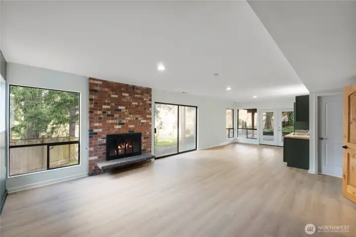This is great space for entertaining with wood burning fireplace, slider to the backyard, French doors to the covered patio.  Brand new LVP flooring, new paint, and can lighting.