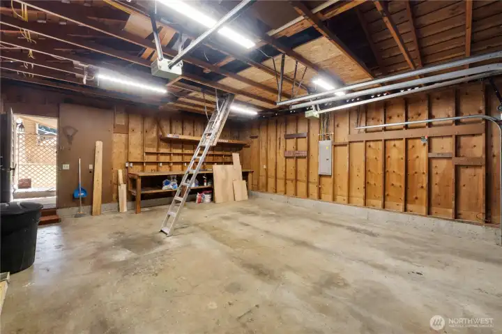2 car garage, with shop space.  Features floored storage space above with pull down ladder for eacy access.