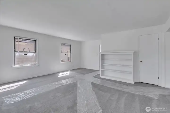 Entry to living room with bookshelf.