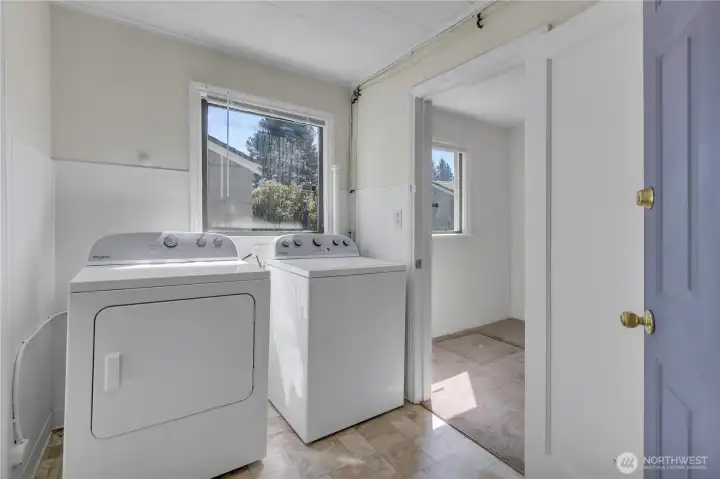 Laundry with new washer and dryer.