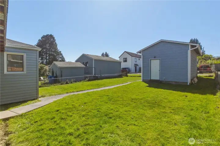 Large yard with unattached garage. New roof on home and garage.
