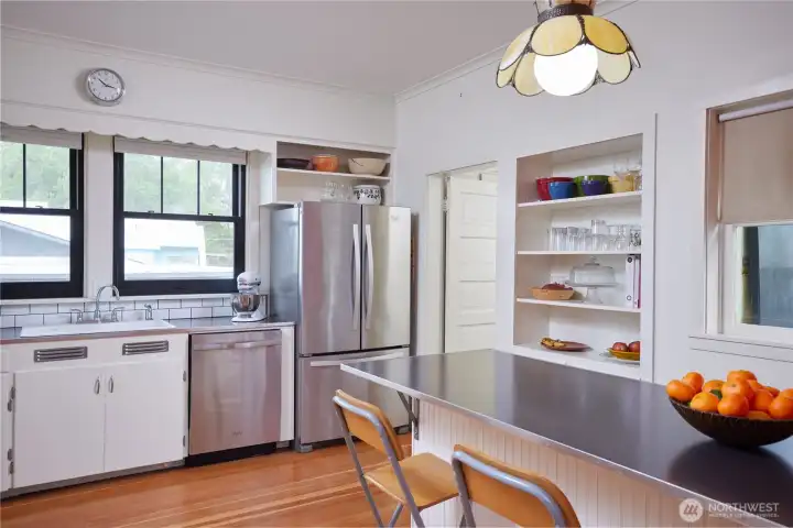 Kitchen showing exit to back entryway