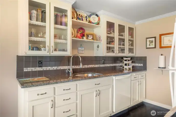 Beautiful updated and maintained kitchen with glass display cabniets