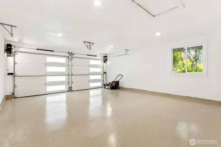 Improved heavy duty pull down access stairs with expanded storage area above. New insulated garage doors, painted walls and finished floors. Improved heavy duty pull down access stairs with expanded storage area above. New insulated garage doors, painted walls and finished floors.
