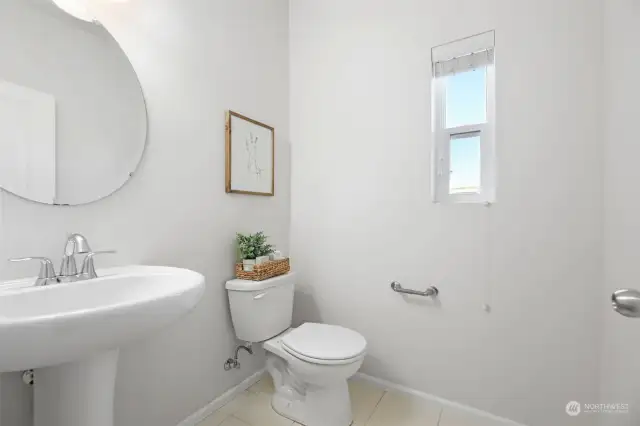 Main floor powder room with window and privacy fan