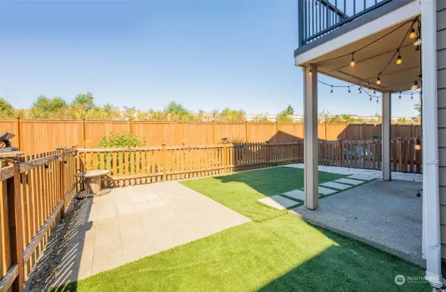Generous sized yard for townhouse living! Plenty of room to have a BBQ and entertain. Additional HOA common space beyond fence