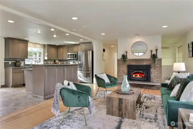 The open living room is fantastic for entertaining with its cozy, wood burning stove.