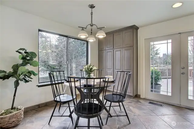 The dining room has French doors which open on to the large deck.