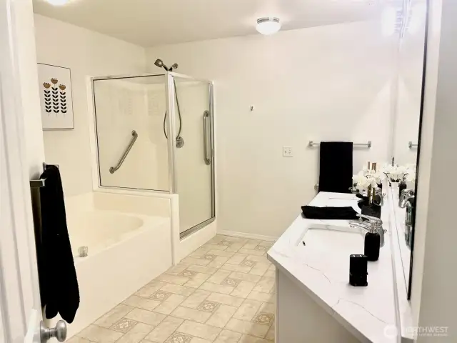 Primary bathroom w/ large shower, big soaking tub & dual sink vanity with new quartz counters & undermount sinks