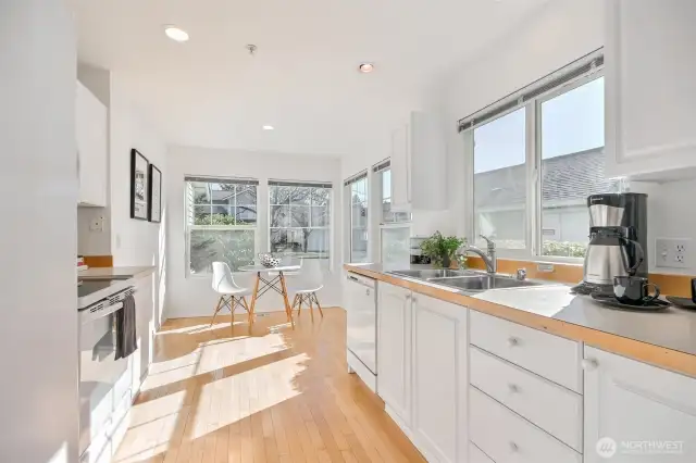 Great kitchen with hardwood floors, big windows for natural light, lots of cabinets, all the appliances stay. Come take a look & you'll love this kitchen too.