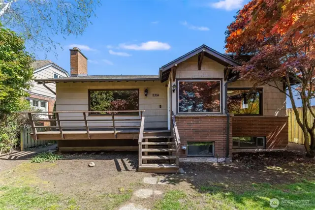 Large picture windows allow for expansive views out to the yard.