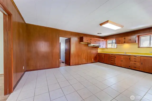 So much potential in this very large kitchen space.