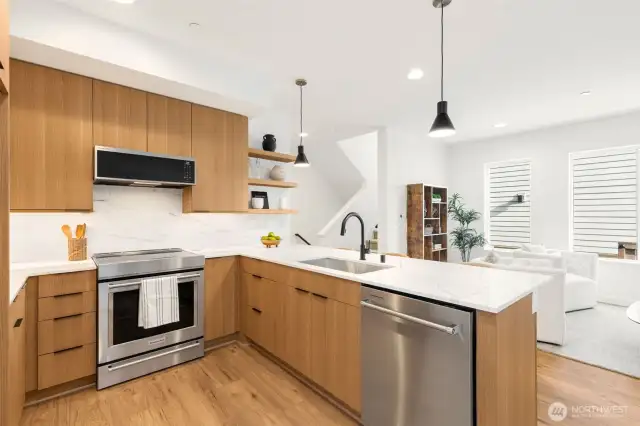 Kitchen boasts plenty of cabinet & countertop space. Stainless appliances.