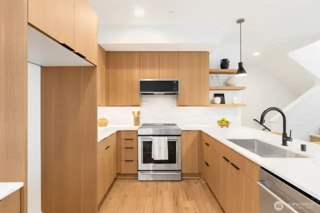 Quartz Countertops. Kitchenaid Appliances include Induction Range.