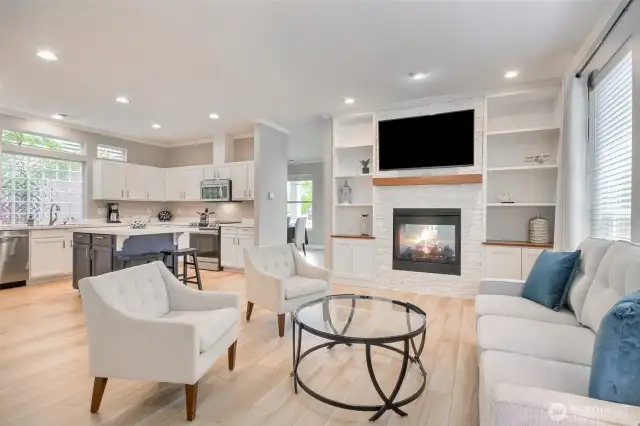 Beautiful family room open to the big kitchen. Updated fireplace wall with built-in bookcases, stone fireplace wall with wood mantle.