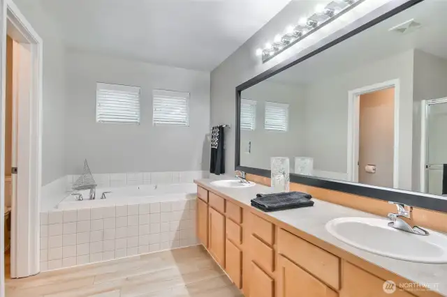 5 piece primary bathroom with dual sink vanity, large soaking tub, big shower & private wc