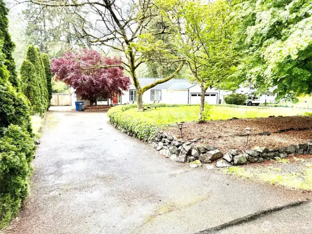 Exit from loop driveway. RV parking on the side.