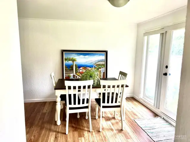 Dining room near the kitchen and door to the large fenced back yard