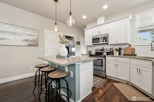 Timeless features like white cabinets and granite countertops.