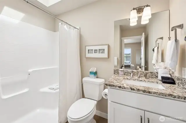 Attached bath with step-in shower.