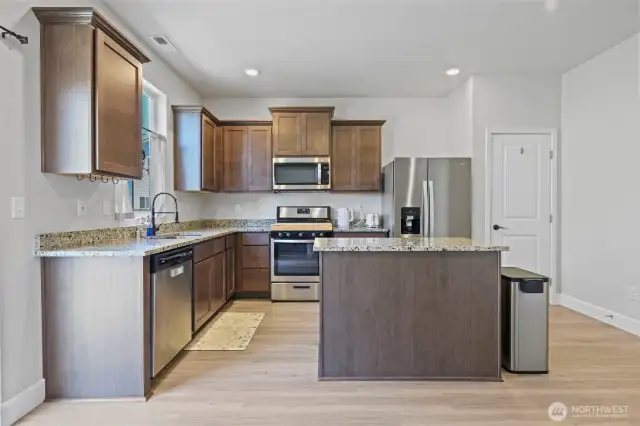 Kitchen with rich wood cabinets