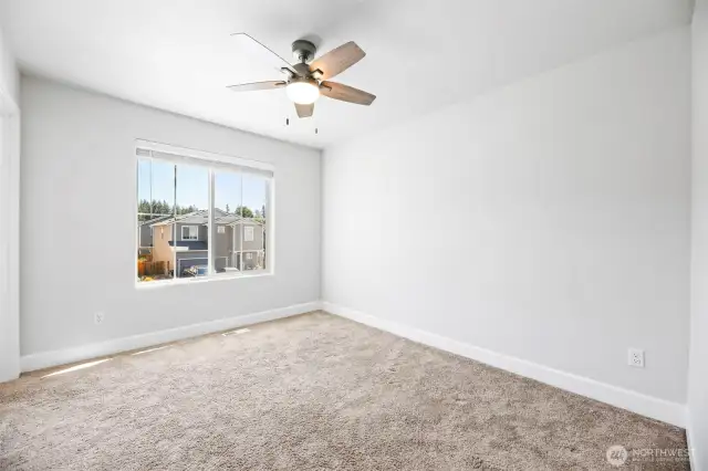 Bedroom #3 with cieling fan and walk-in closet