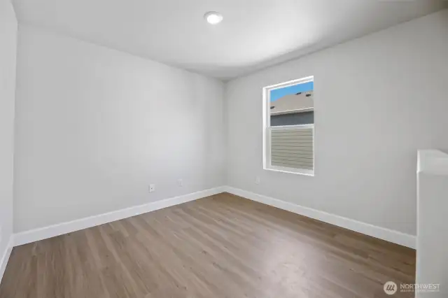 Lofted area with plank flooring