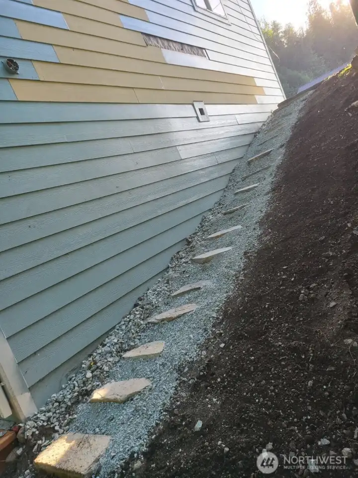 Side Stone Step Way towards back basement entrance