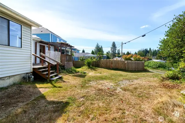 Backyard and deck off rear of home.