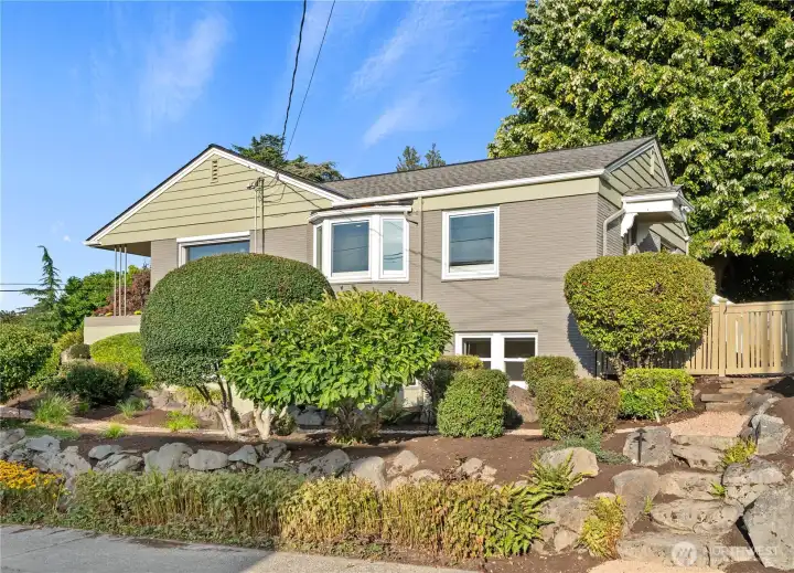 The verdant front yard is terraced and planted with drought resistant landscaping. The new landscape lighting makes the place come alive at night!