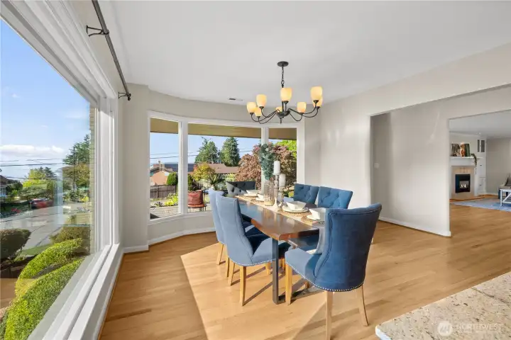 Entertain guests in style while enjoying stunning 90-degree views. Admire the freshly refinished hardwood floors that add warmth and elegance to every gathering!