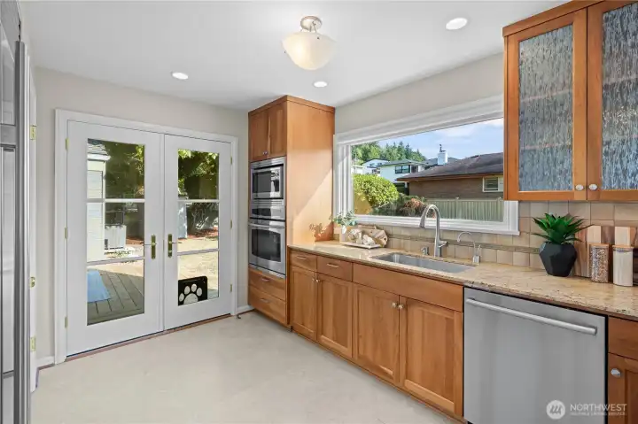Having the kitchen overlook a big, flat backyard makes it easy to keep an eye on things outside while cooking or hanging out in the kitchen.