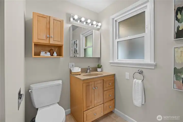 The main floor offers a second full bath for guests.