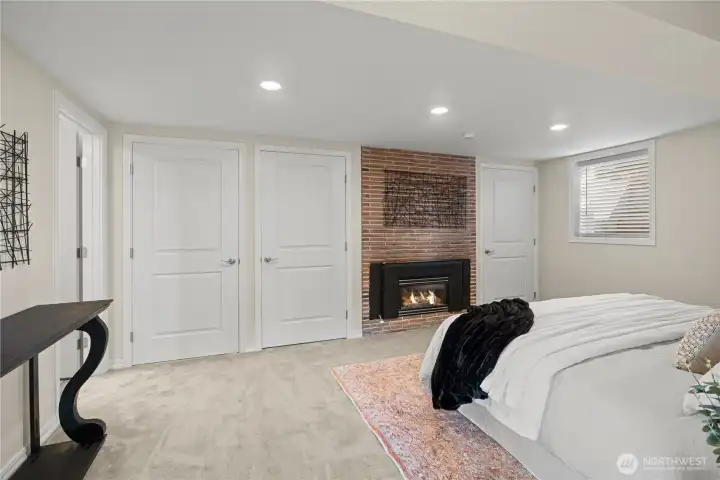 You'll love the lower-level Ensuite Primary bedroom with its cozy gas fireplace!