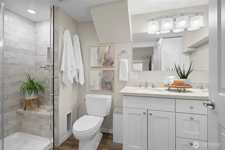 Updated primary Ensuite bath on lower-level features plenty of storage.