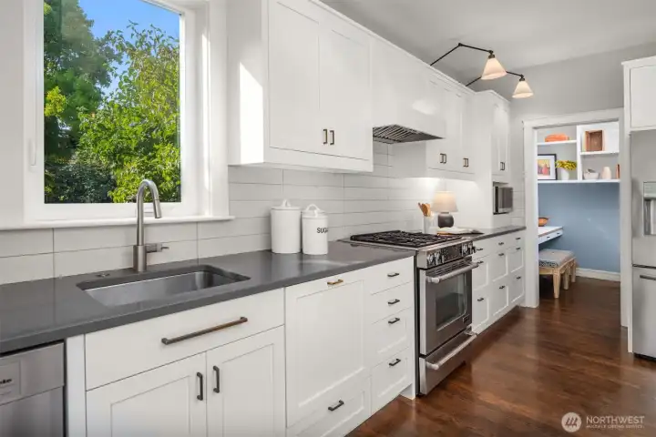 Quartz countertops and a tiled backsplash are just some of the design finishes.