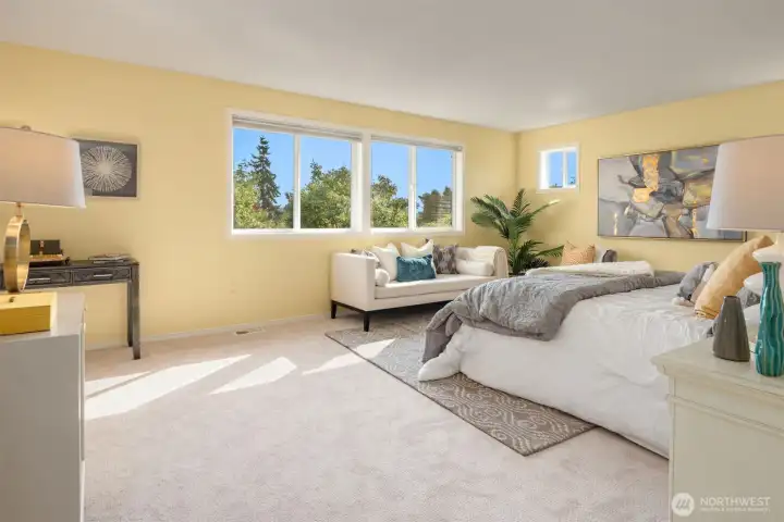 This spacious primary suite with treetop views is your new haven!