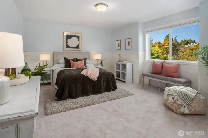 Large additional bedroom with wainscotting.