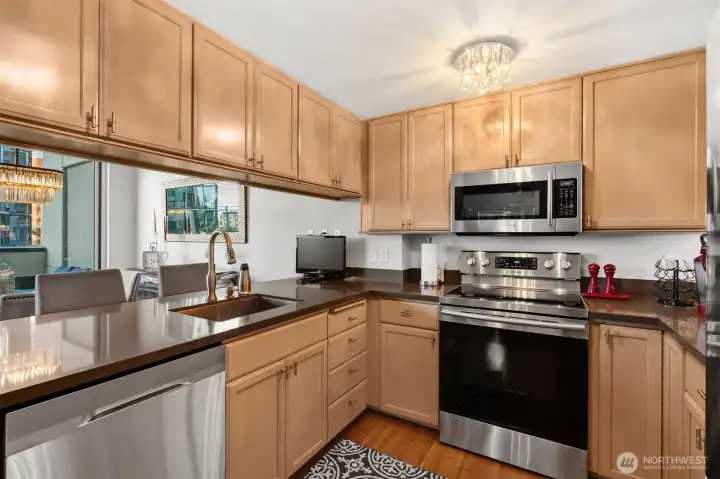 Functional layout with ample storage and bar seating.