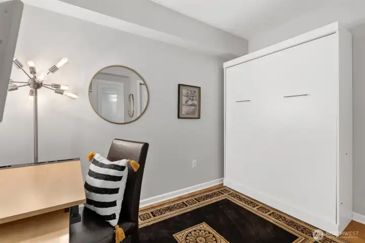 Flexible den perfect for home office or guest room, featuring a custom Murphy bed.