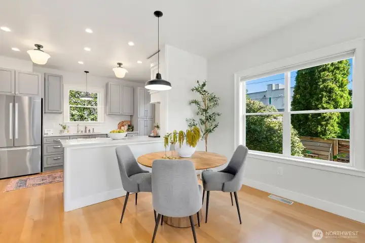 The owners had a rectangular table here that abutted the kitchen peninsula. You can fit a large table in this space!