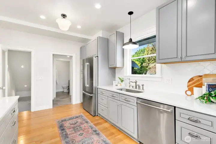 Looking down the kitchen and you can see the door to the right - that leads to the mudroom and backyard deck/access.