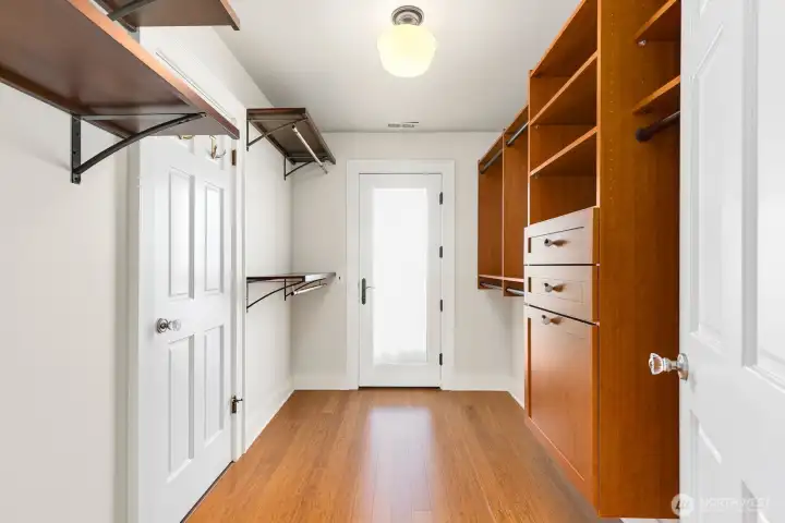 Walk-in Closet off primary bedroom. Even though the upstairs bathroom is shared, there is still a private entrance to it on the left here from the primary.