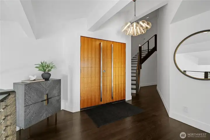 The entrance to the home is on the upper level and hosts 3 of the 5 bedrooms